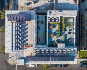 Solar Water Heating Optimizes Energy Efficiency and Reduces Carbon Footprint in Apartment Buildings with Central Domestic Water Heating Systems